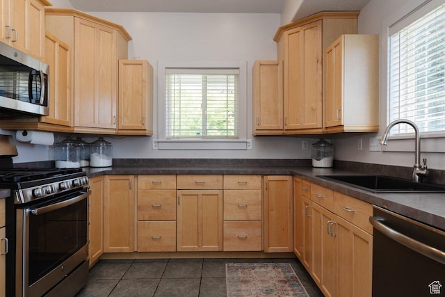 287 S 375 W, Providence, UT 84332 - kitchen with plenty of natural light, light brown cabinets, sink, and stainless steel appliances