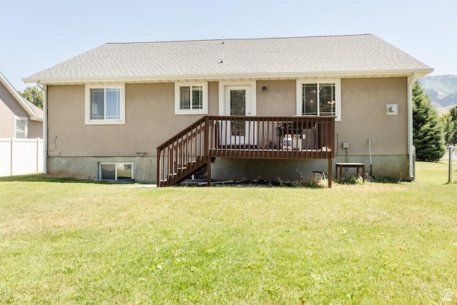 287 S 375 W, Providence, UT 84332 - rear view of house with a lawn and a wooden deck