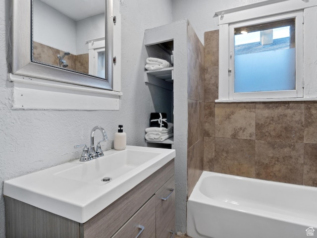 bathroom featuring vanity and bathtub / shower combination