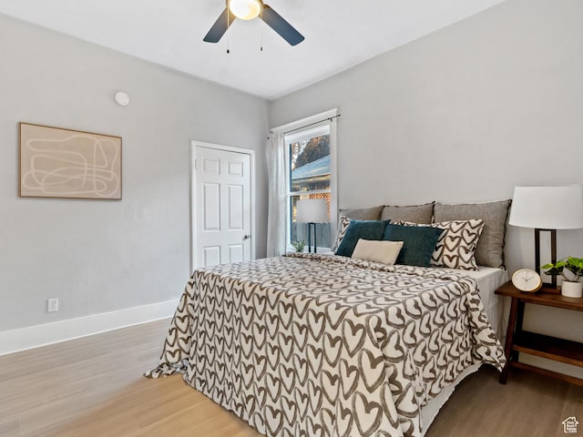 bedroom featuring ceiling fan and light hardwood / wood-style flooring