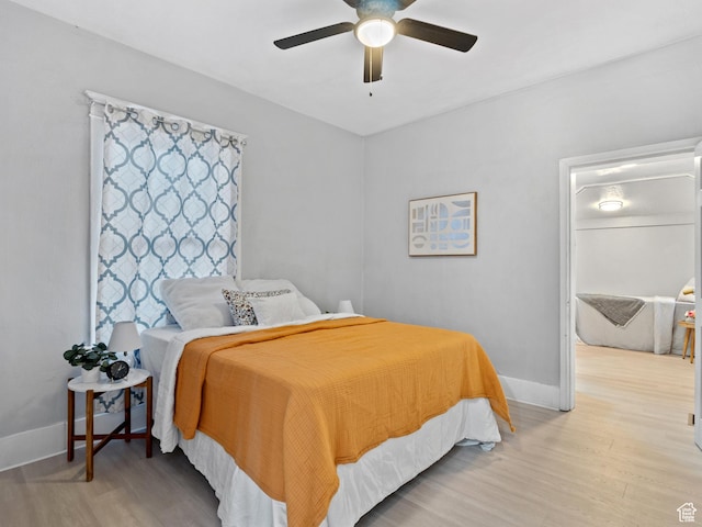 bedroom featuring ceiling fan and light hardwood / wood-style floors