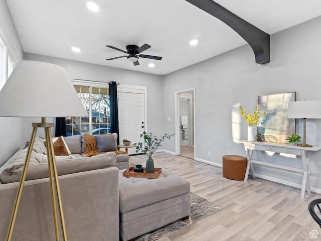 living room featuring ceiling fan and light wood-type flooring