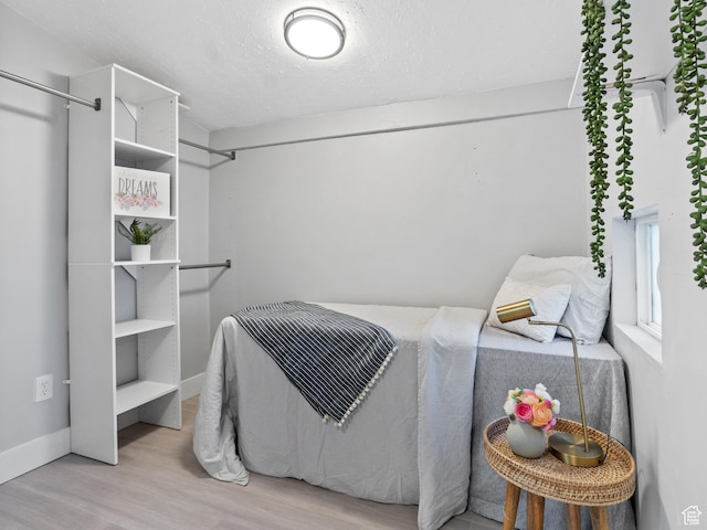 bedroom with light hardwood / wood-style floors
