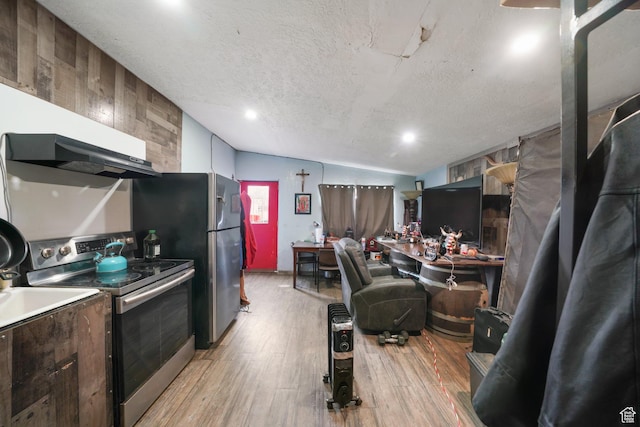 513 W Lake St, Ogden, UT 84401 - kitchen with light hardwood / wood-style flooring, lofted ceiling, a textured ceiling, wooden walls, and stainless steel range with electric cooktop