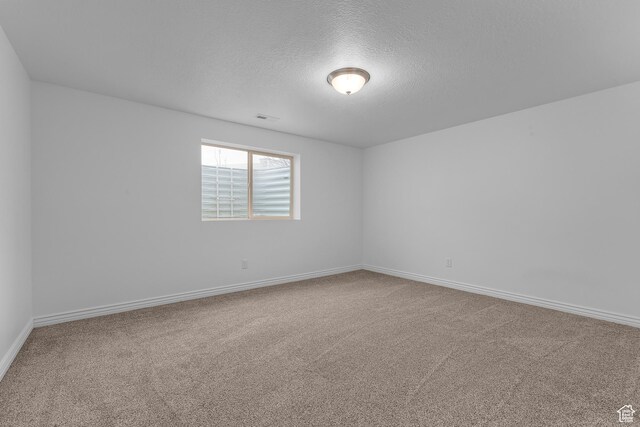 649 E 5650 S, Washington Terrace, UT 84405 - empty room with a textured ceiling and carpet floors