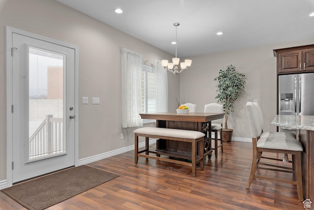 649 E 5650 S, Washington Terrace, UT 84405 - dining area featuring dark hardwood / wood-style flooring, an inviting chandelier, and a wealth of natural light