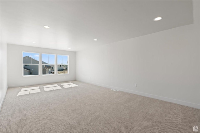 empty room with light colored carpet