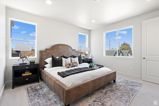 bedroom featuring light carpet
