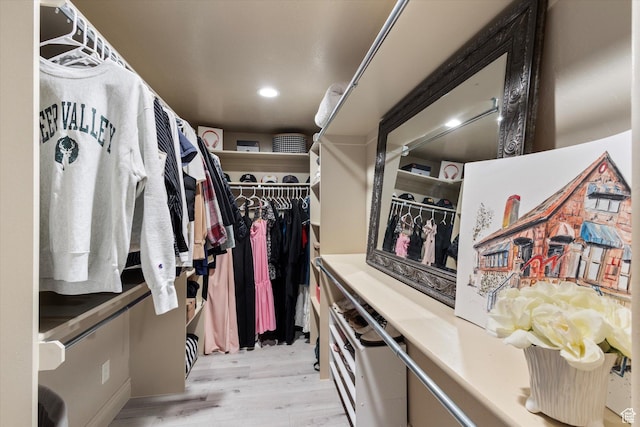walk in closet featuring light hardwood / wood-style floors