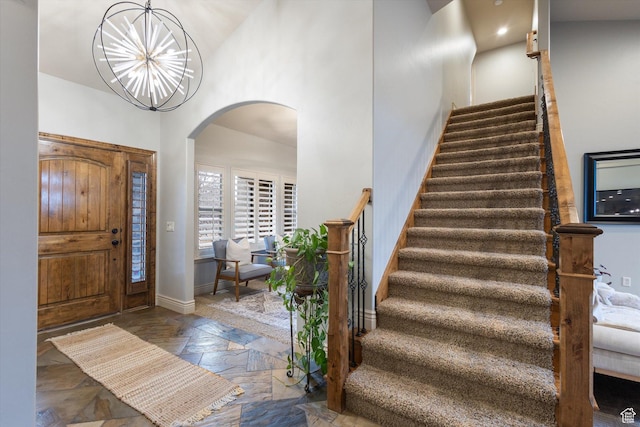 entryway featuring a chandelier