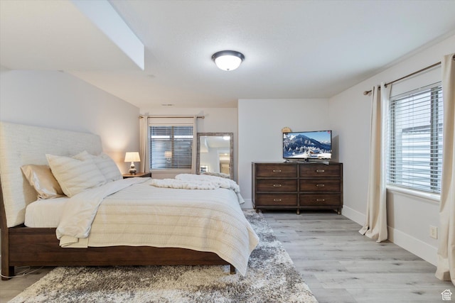 bedroom with light hardwood / wood-style floors