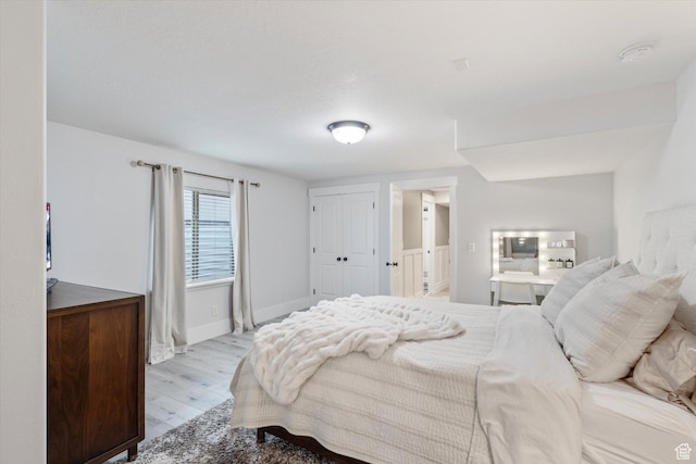 bedroom with light hardwood / wood-style floors