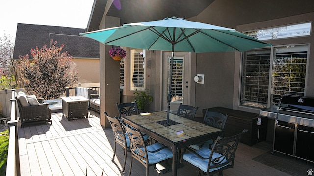 deck with grilling area and an outdoor living space