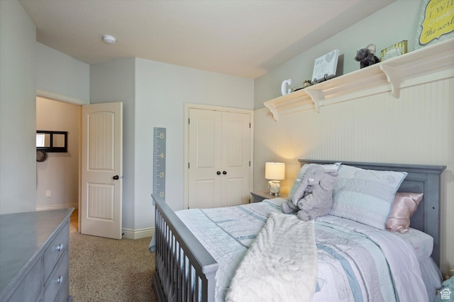 carpeted bedroom with a closet