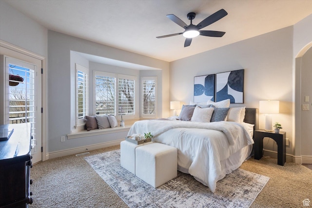 carpeted bedroom featuring access to outside and ceiling fan