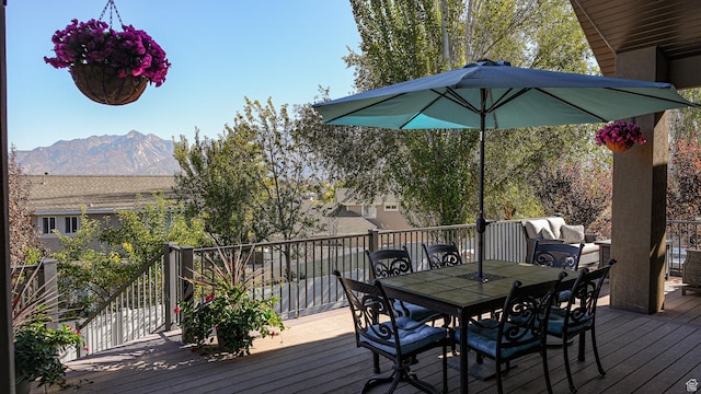 wooden deck featuring a mountain view