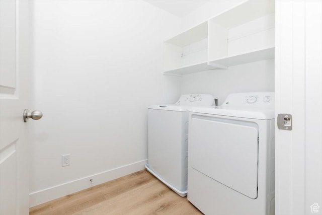 83 E 750 S Unit 05, Springville, UT 84663 - laundry area featuring washing machine and dryer, light wood-style floors, and baseboards