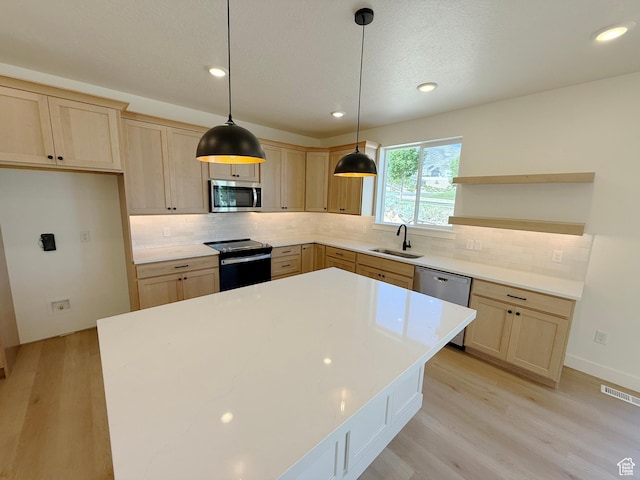 3241 S Red Wolf Dr, Saratoga Springs, UT 84045 - kitchen with stainless steel appliances, open shelves, light brown cabinetry, light wood-type flooring, and recessed lighting
