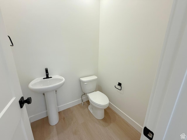 3241 S Red Wolf Dr, Saratoga Springs, UT 84045 - bathroom featuring wood finished floors, toilet, and baseboards