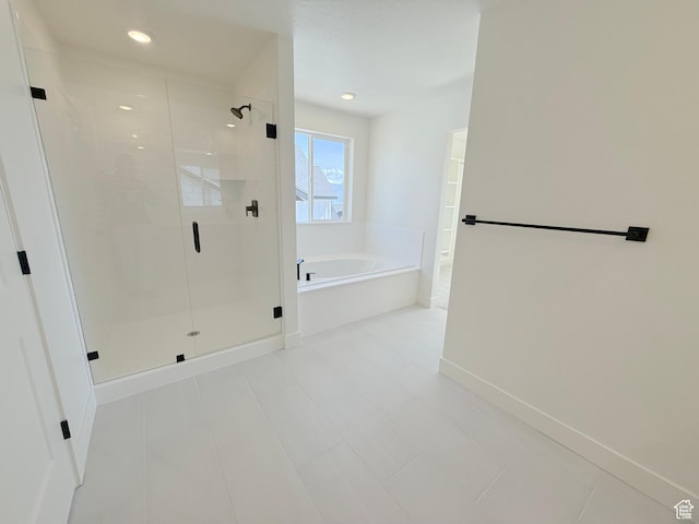 3241 S Red Wolf Dr, Saratoga Springs, UT 84045 - full bathroom with a bath, a stall shower, baseboards, and recessed lighting