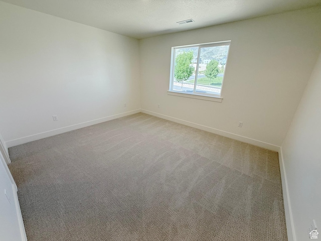 3241 S Red Wolf Dr, Saratoga Springs, UT 84045 - empty room with baseboards and light colored carpet