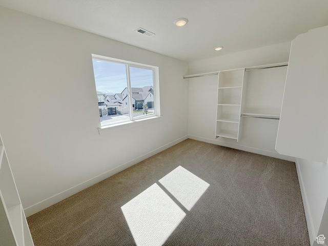 3241 S Red Wolf Dr, Saratoga Springs, UT 84045 - unfurnished bedroom with light carpet, baseboards, recessed lighting, and a closet