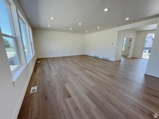 3241 S Red Wolf Dr, Saratoga Springs, UT 84045 - empty room featuring light wood finished floors, recessed lighting, and baseboards