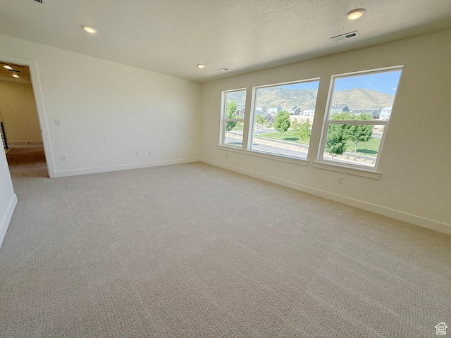 3241 S Red Wolf Dr, Saratoga Springs, UT 84045 - spare room with baseboards, light carpet, and recessed lighting