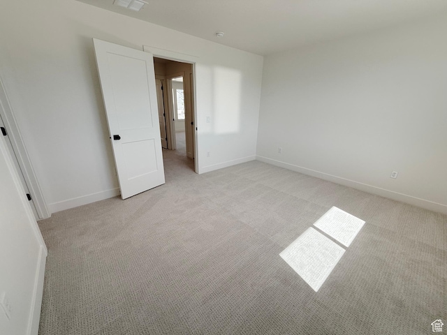 3241 S Red Wolf Dr, Saratoga Springs, UT 84045 - unfurnished room with light carpet, baseboards, and a smoke detector