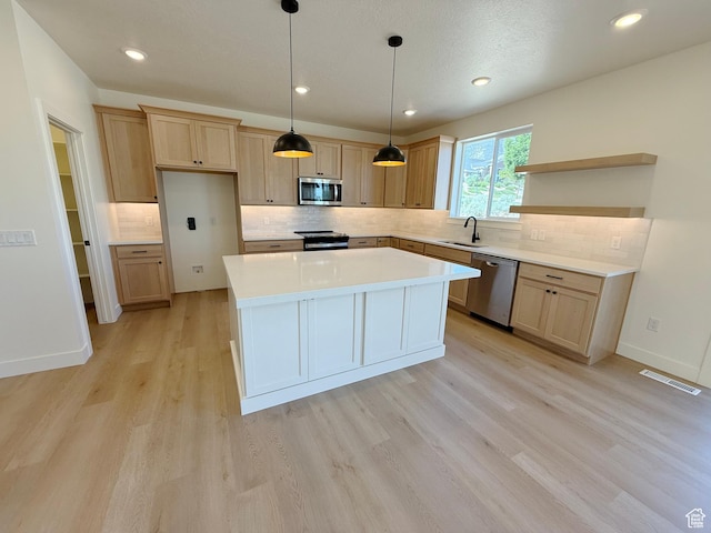 3241 S Red Wolf Dr, Saratoga Springs, UT 84045 - kitchen featuring stainless steel appliances, a sink, open shelves, light wood-style flooring, and backsplash
