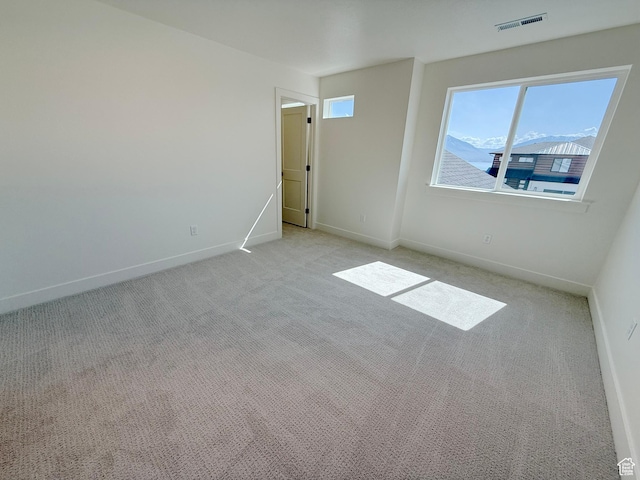 3241 S Red Wolf Dr, Saratoga Springs, UT 84045 - spare room with light carpet and baseboards