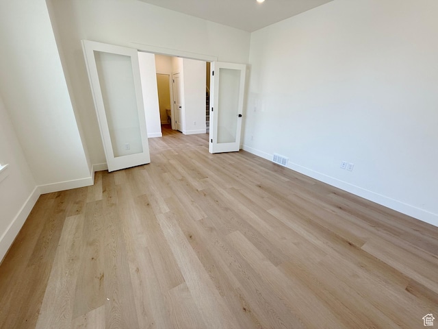 3241 S Red Wolf Dr, Saratoga Springs, UT 84045 - unfurnished bedroom with light wood finished floors and baseboards