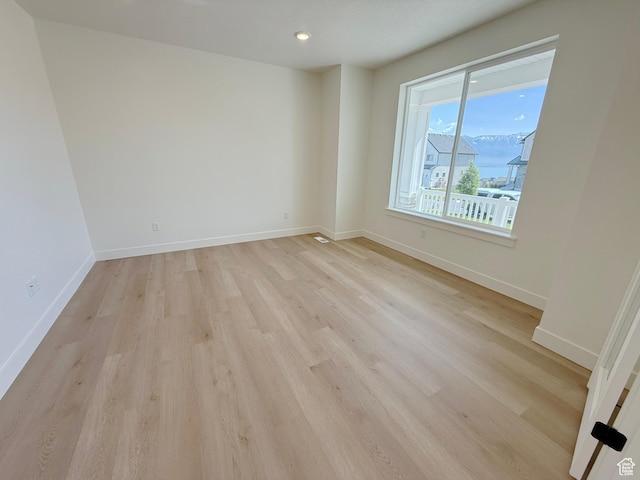 3241 S Red Wolf Dr, Saratoga Springs, UT 84045 - spare room with light wood-style flooring, baseboards, and recessed lighting