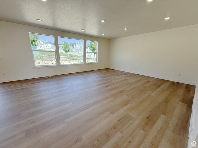 3241 S Red Wolf Dr, Saratoga Springs, UT 84045 - unfurnished room with recessed lighting, light wood finished floors, and baseboards