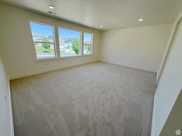 3241 S Red Wolf Dr, Saratoga Springs, UT 84045 - empty room with light colored carpet, baseboards, and recessed lighting