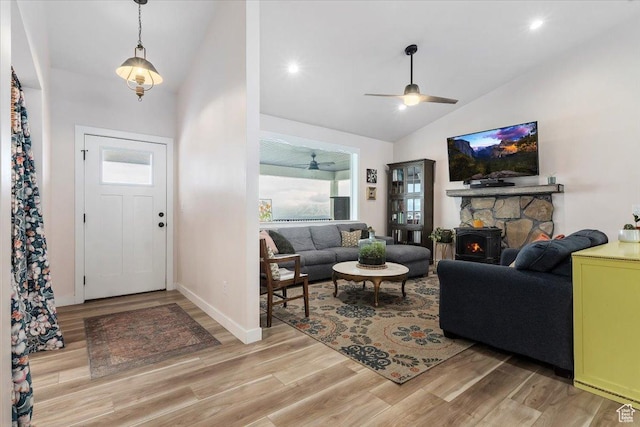 13802 S Mount Shaggy Dr, Herriman, UT 84096 - entrance foyer with a wood stove, ceiling fan, high vaulted ceiling, and light hardwood / wood-style floors