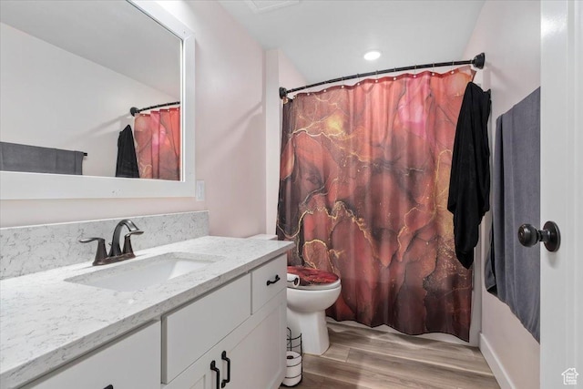 13802 S Mount Shaggy Dr, Herriman, UT 84096 - bathroom with hardwood / wood-style floors, vanity, and toilet