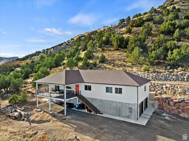 13802 S Mount Shaggy Dr, Herriman, UT 84096 - exterior space featuring a deck with mountain view and a garage