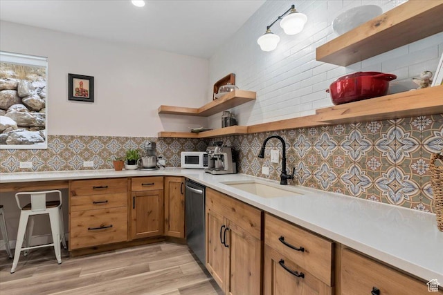 13802 S Mount Shaggy Dr, Herriman, UT 84096 - kitchen with backsplash, dishwasher, light wood-type flooring, and sink