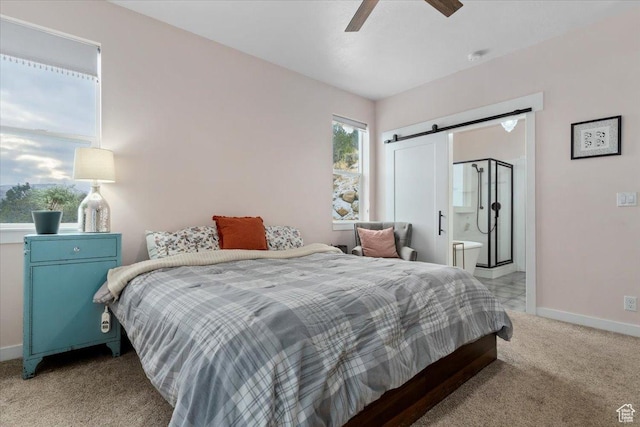 13802 S Mount Shaggy Dr, Herriman, UT 84096 - bedroom featuring a barn door, light colored carpet, ceiling fan, and connected bathroom