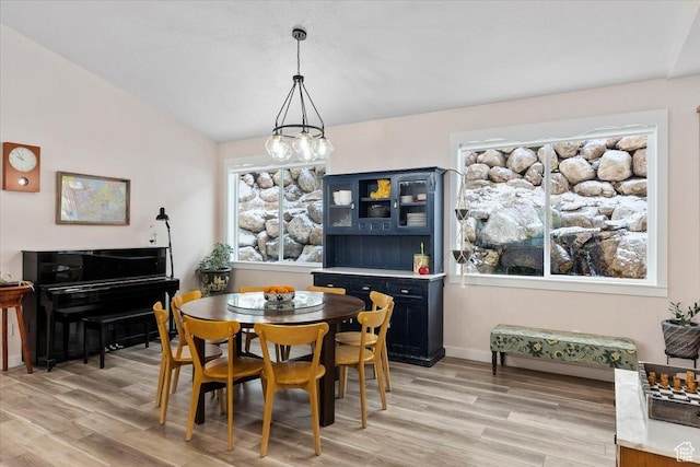 13802 S Mount Shaggy Dr, Herriman, UT 84096 - dining space with vaulted ceiling and light hardwood / wood-style flooring