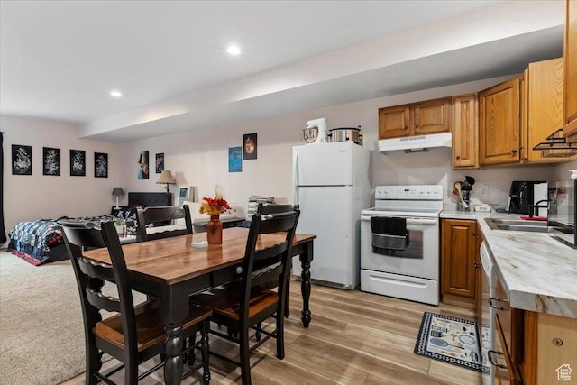 13802 S Mount Shaggy Dr, Herriman, UT 84096 - kitchen with light wood-type flooring, white appliances, and sink