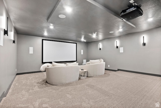 carpeted home theater with a textured ceiling