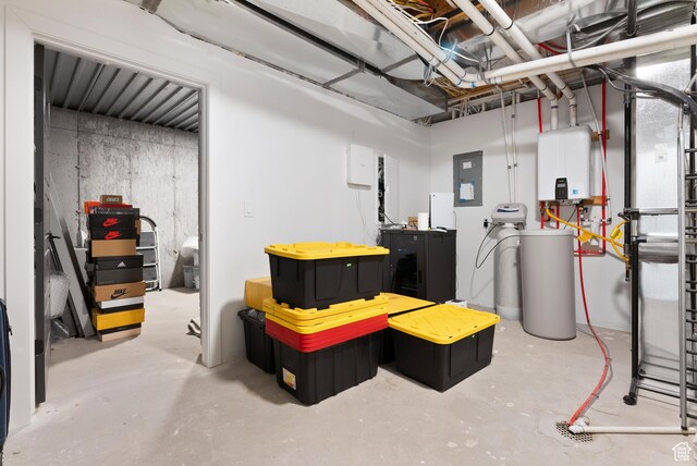 basement with electric panel and water heater