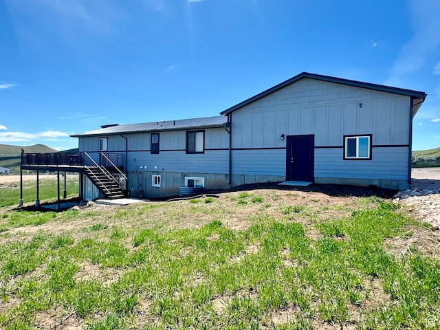 3092 S Country Club Way, Garden City, UT 84028 - back of house with stairway and a deck