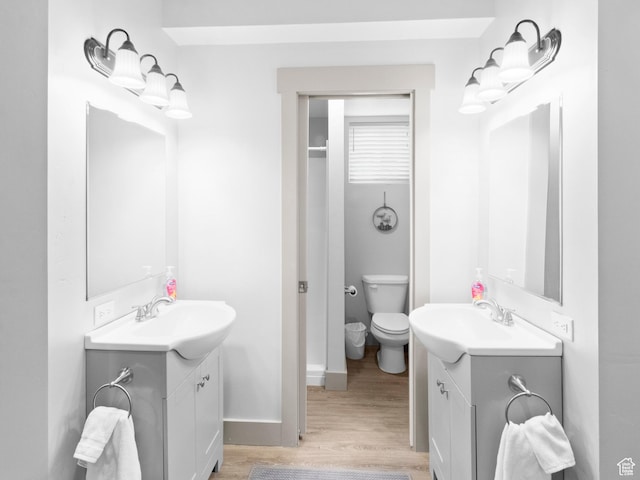 3092 S Country Club Way, Garden City, UT 84028 - bathroom with two vanities, a sink, and wood finished floors