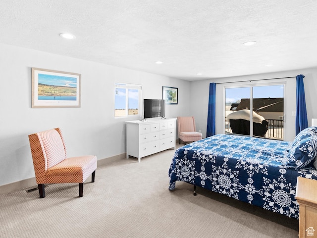 3092 S Country Club Way, Garden City, UT 84028 - bedroom with access to exterior, multiple windows, carpet flooring, and a textured ceiling