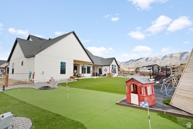 rear view of property with a mountain view