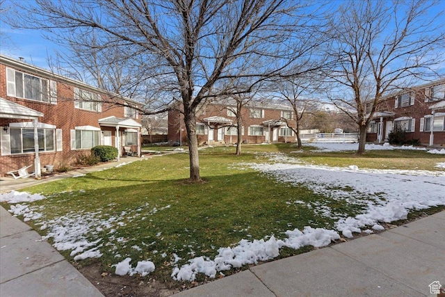 view of yard layered in snow