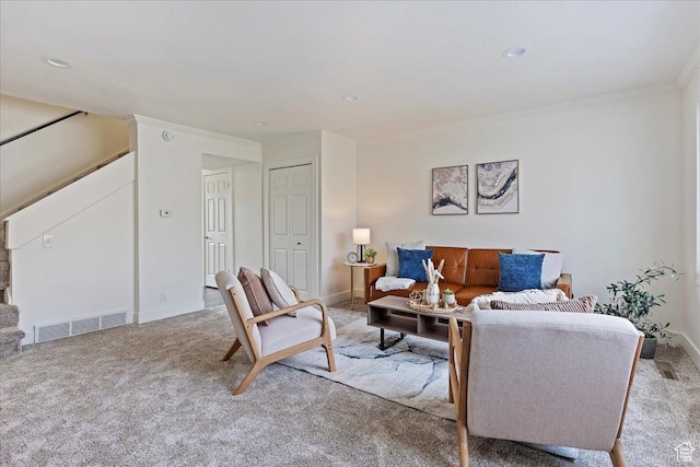 living room with crown molding and light carpet